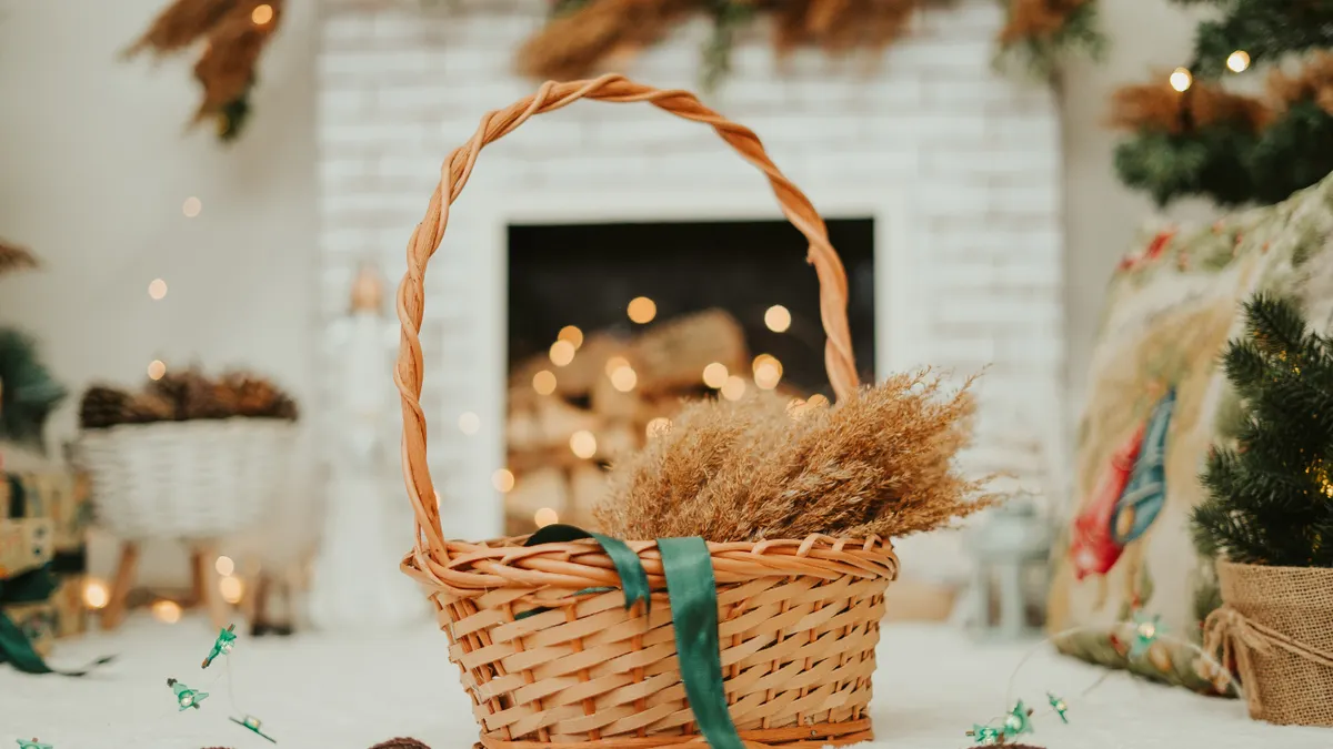 Decorated wicker basket with ribbon and dried filler