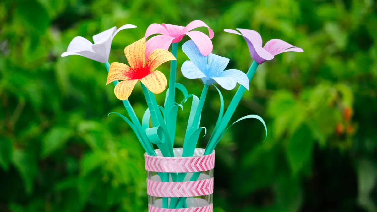 Paper flower bouquet in a wrapped vase
